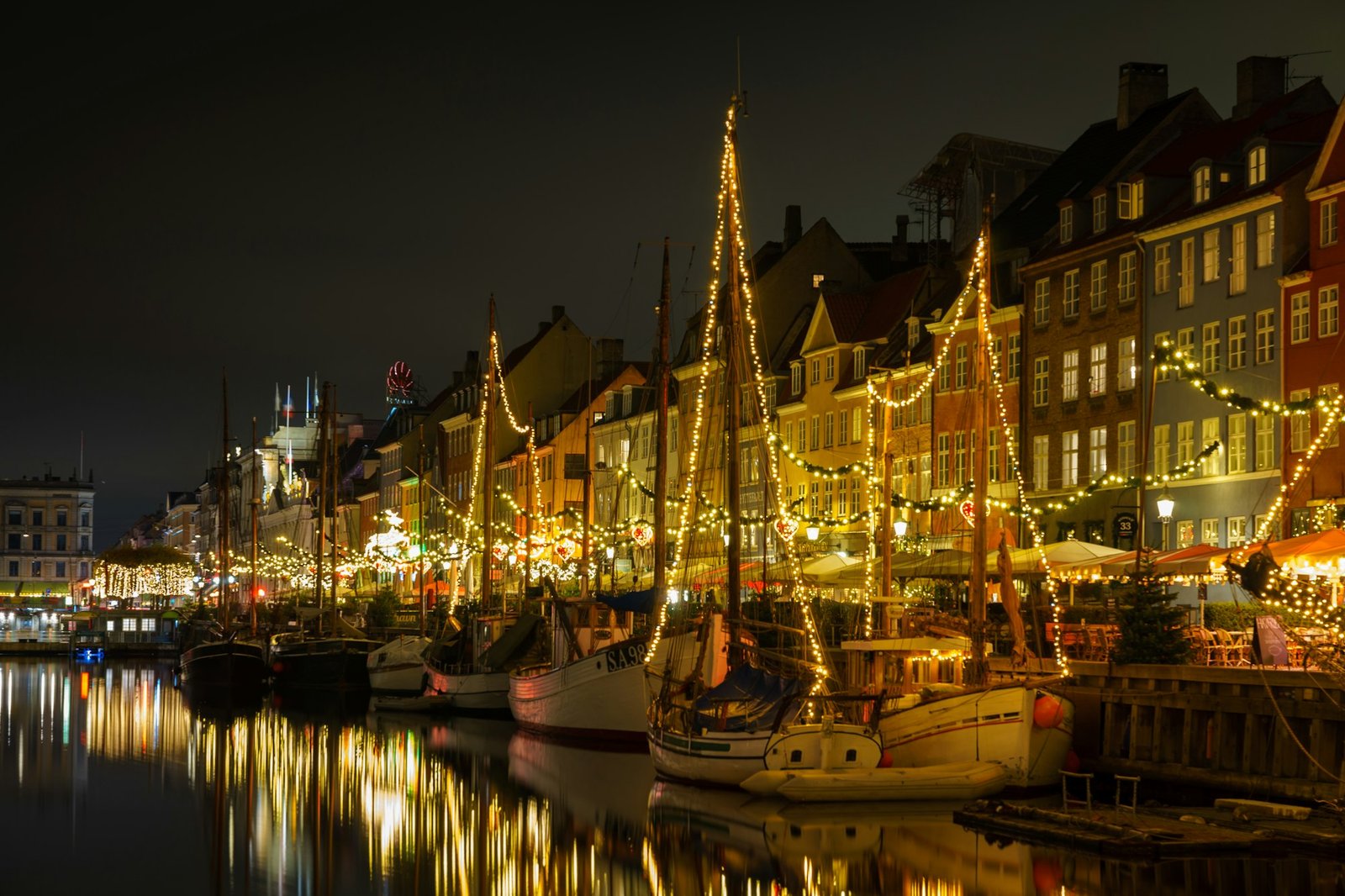 Christmas lights reflected in the canal at Nyhavn, Copenhagen