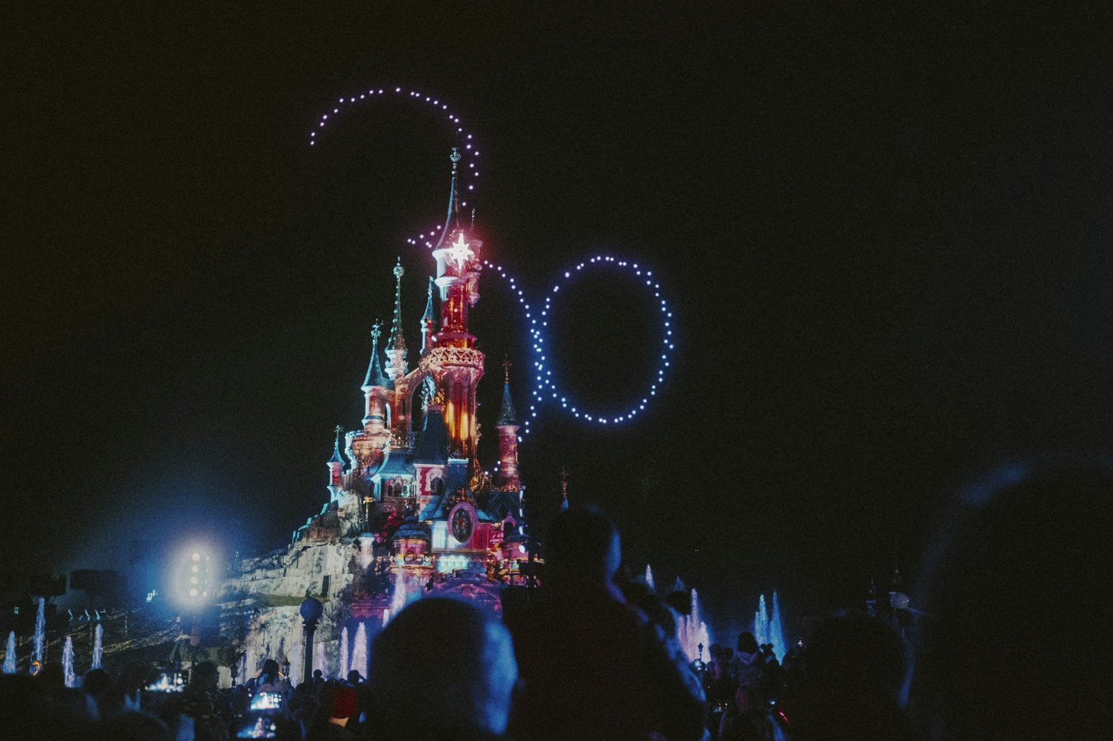 Crowds watching the night-time show at Disneyland Paris